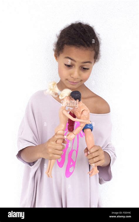 Girl Playing With Naked Dolls Stock Photo Alamy