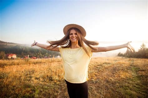 Young Carefree Woman Enjoying Nature And Sunlight In Straw Hat Stock