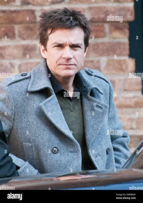 Actor Jason Bateman Has A Stern Look On His Face As He Chats Outside