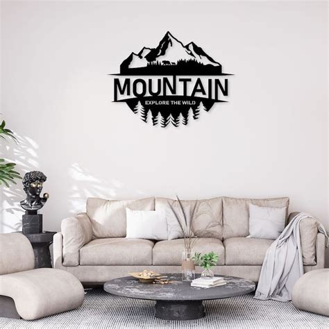 a living room filled with furniture and a mountain logo on the wall ...