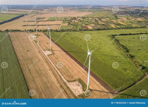 Aerial View Of Wind Turbine Generators In Field Producing Clean