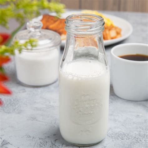 Acopa 10 Oz Embossed Glass Milk Bottle With Lid 12 Case