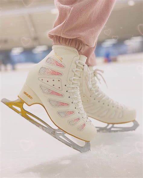 A Person Is Skating On The Ice With Their Feet In The Air And Wearing