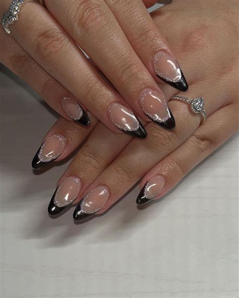 Chic Black French Tip Nails With Reflective Glitter