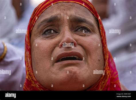 Tears Roll Down The Cheeks Of A Kashmiri Muslim Woman As The Head