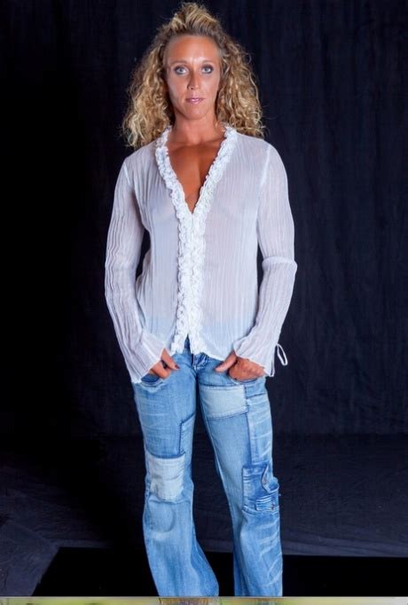 Blonde Bodybuilder With Tiny Tits Flexes While Topless In Blue Jeans