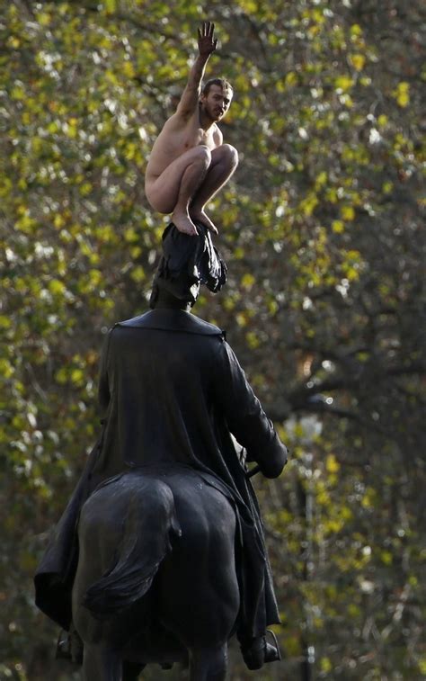 Naked Man Sits On Statue In Central London For Three Hours