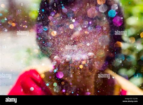 blowing glitter Stock Photo - Alamy