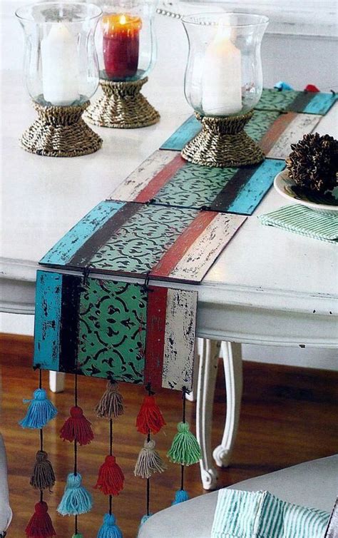 The Table Is Decorated With Candles And Ornaments