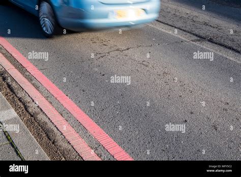 Double Red Lines Marking On A Road No Stopping No Waiting No