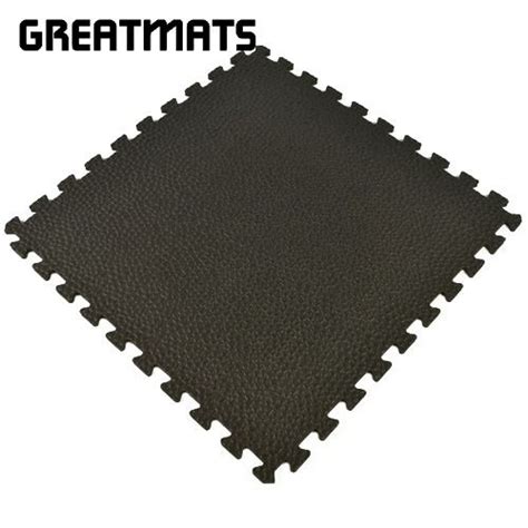 These rugged, high-density EVA foam gym mats for home features a pebble top surface design that ...