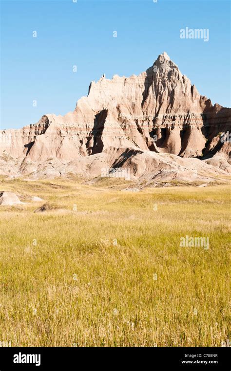 Sculpted Spires Rise Above Prairie Grasslands In Badlands National Park