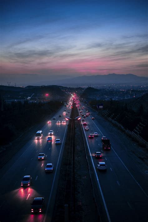 A highway filled with lots of traffic at night photo – Free City lights ...