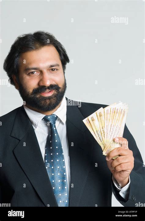 Man Holding Indian Rupee Notes Hi Res Stock Photography And Images Alamy