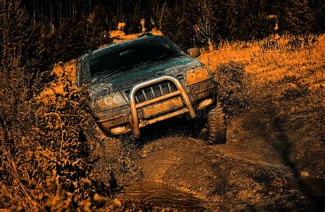 Off-road Travel on Mountain Road. Mudding is Off-roading through an ...
