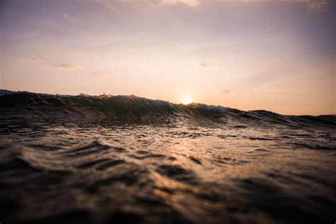 breaking wave  sunset royalty  stock photo  image