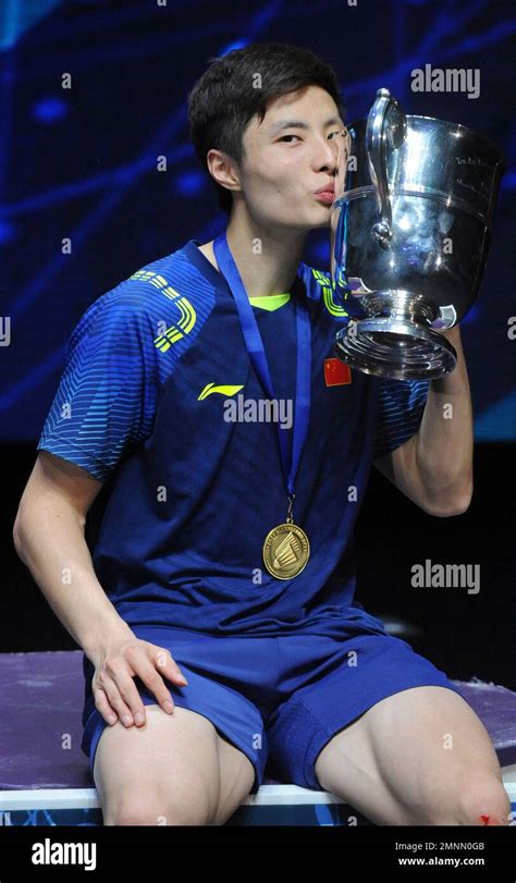 China S Shi Yuqi Poses With His Trophy After Defeating China S Lin Dan