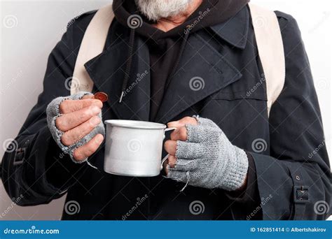 Unrecognizable Homeless Woman Sit On A Bus Stop Homeless People