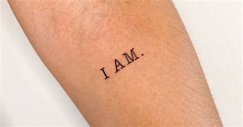 I Am Temporary Lettering Tattoo Placed On The Inner