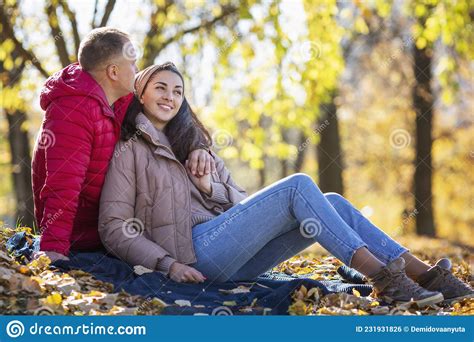 Young Laughing Man And Woman Hugging In The Autumn Park Romantic Couple On A Date Love And