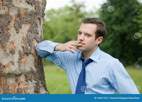 Young Businessman Leaning Against A Tree Stock Image Image Of Park