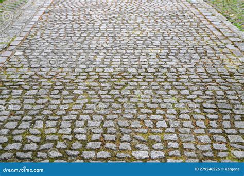 An Old Stoneblock Pavement Cobbled With Rectangular Granite Blocks