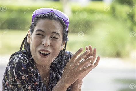 Asian Woman Play Water In Songkran Festival Or Thai New Year In