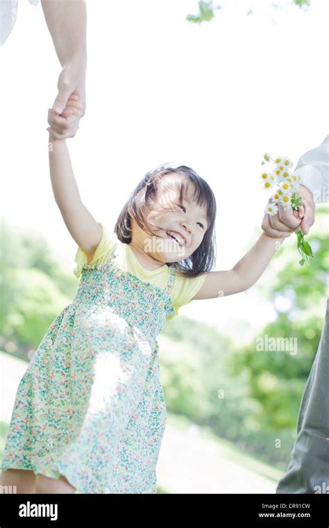 A family holding hands Stock Photo - Alamy