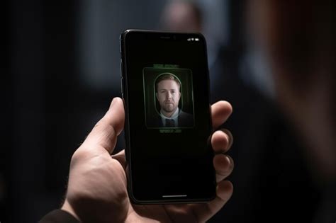 Premium Photo Man Using Facial Recognition Technology With Mobile