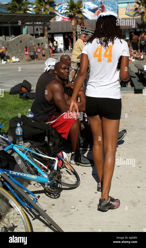 Female Cyclist With Long Legs At Venice Beach California Usa Stock