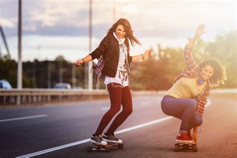 Skateboard Girls Riding Longboards Down The Road Stock Photo Image Of