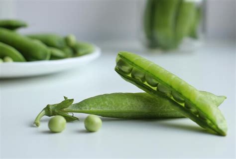 Premium Photo Fresh Green Peas In A Pod And With Peas