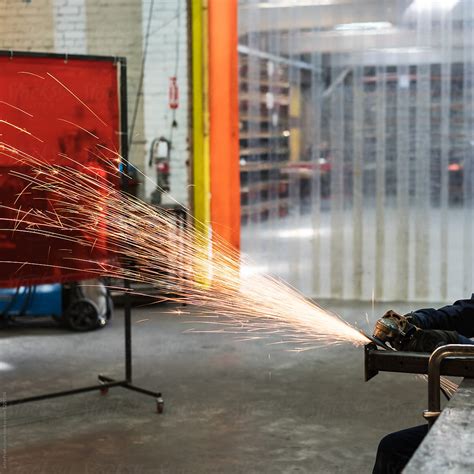 Sparks Fly In A Metal Factory By Stocksy Contributor Walter And Deb