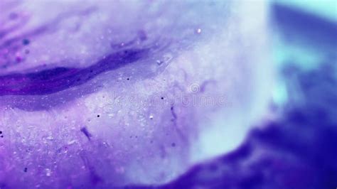 Purple Fluid Motion With Silver Glitter Particles Stock Footage