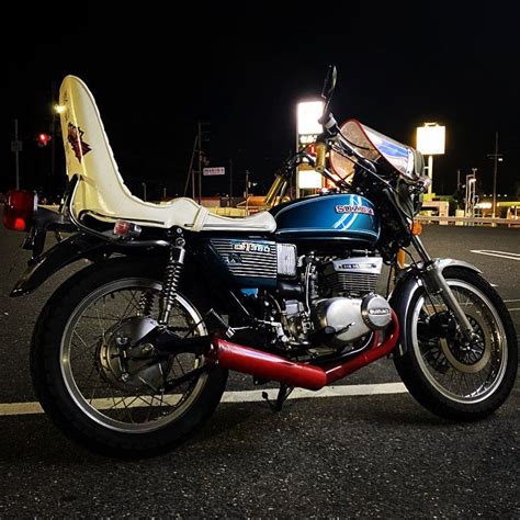 Suzuki Motorcycle Parked On The Street At Night