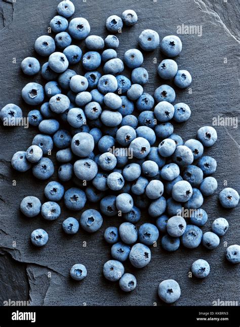 Frozen Blueberry On Black Slate Close Up Top View High Resolution