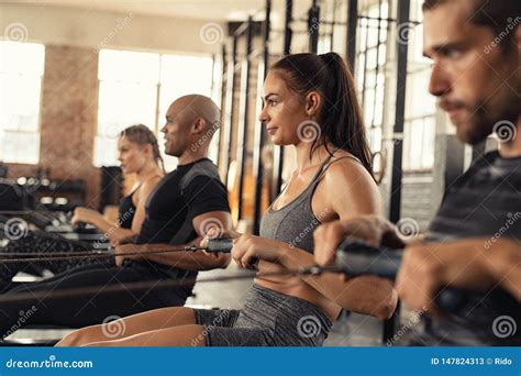 Fitness Class Training On Rowing Machine Stock Image Image Of Strong