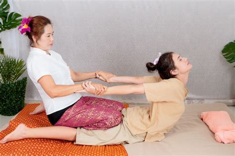 Premium Photo Asian Woman Getting Traditional Thai Stretching Massage