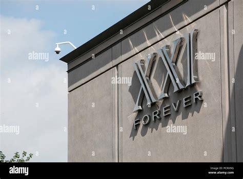 A Logo Sign Outside Of A Forever 21 Xxi Forever Retail Store In