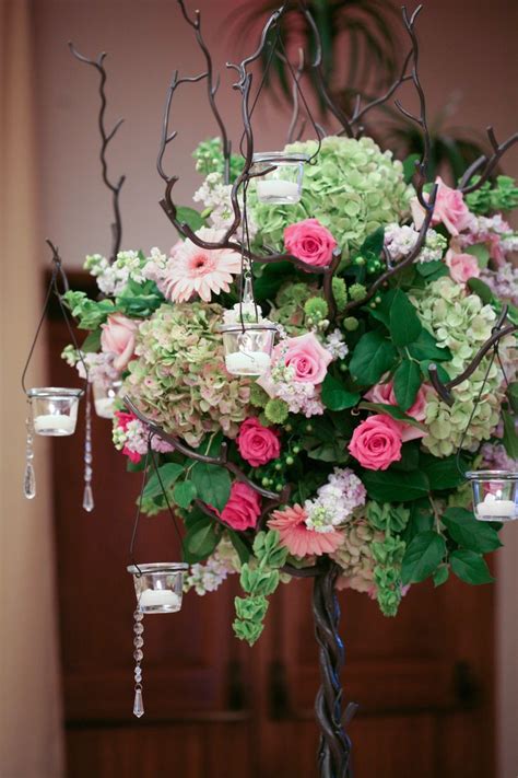 Closer Look At The Tree Centerpiece With Pink Florals And Hanging