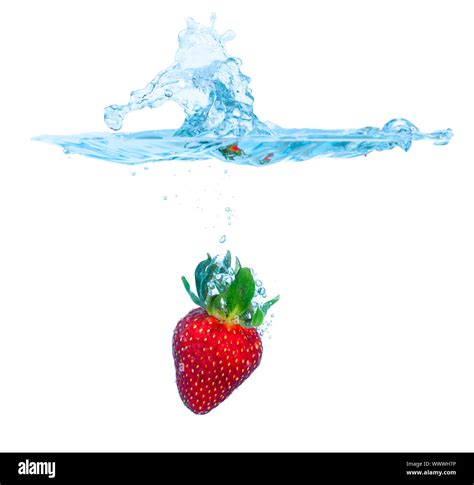 Fresh Strawberry Dropped Into Water With Splash Stock Photo Alamy