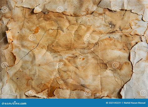 Antique Parchment Paper Texture With Vintage Stains And Torn Edges