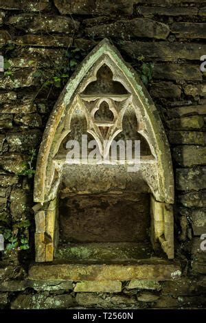 The Holy Water Stoup In The Ornate Gothic Cloister Arcade Arches Of The