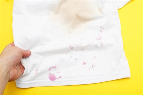 Premium Photo | Dirty stains on a white Tshirt from berries and drink ...