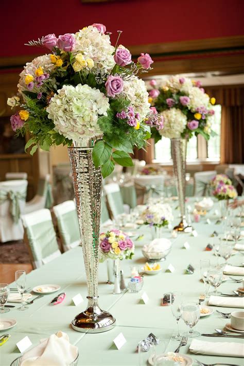 Tall Floral Centerpieces In Silver Vases Weddingday Magazine Tall