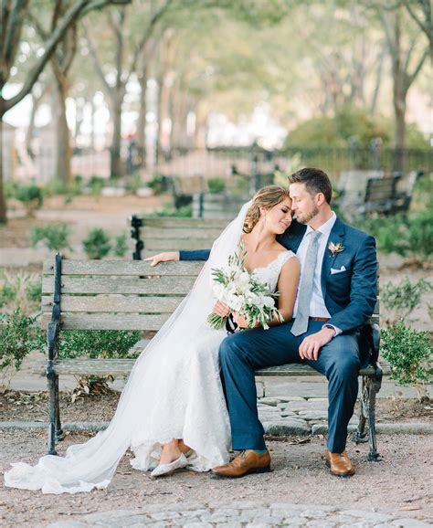 Bride And Groom On A Bench In One Of Their Favorite Parks In Charleston