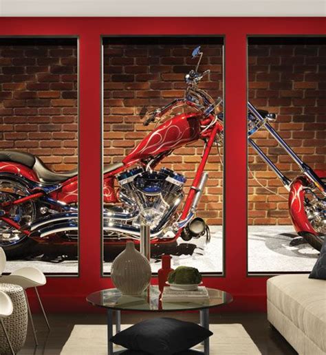 A Red Motorcycle Parked In Front Of A Brick Wall With Three Panes On It