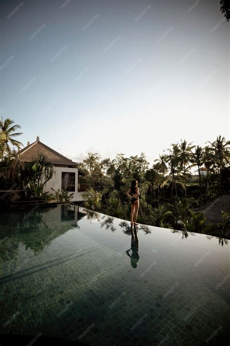 Premium Photo | The pool at the villa ubud