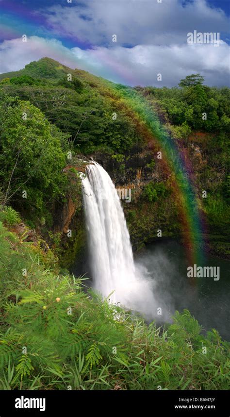 Waterfall in Hawaii With a Colorful Fantastic Rainbow Stock Photo - Alamy