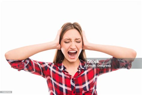 Angry Girl Screaming And Closing Her Ears Stock Photo Download Image